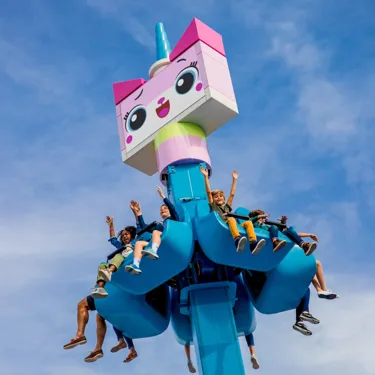 Kids riding Unikitty's Disco Drop at LEGOLAND California