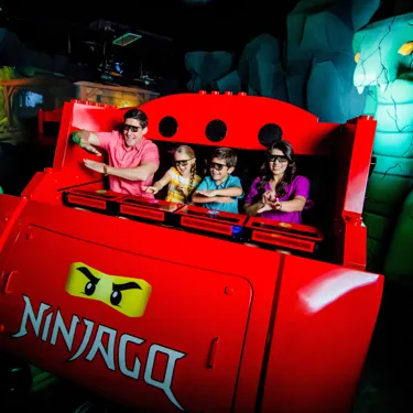 Family riding LEGO NINJAGO The Ride