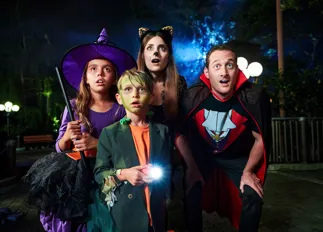 Family in costumes at Brick-or-Treat