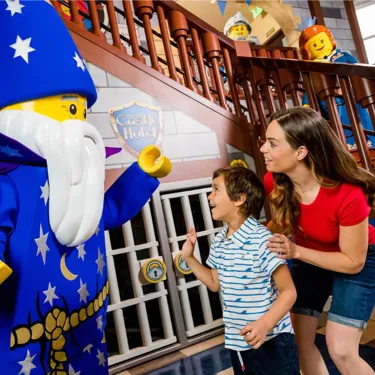 Mom and son meet Merlin the Wizard at the LEGOLAND Castle Hotel