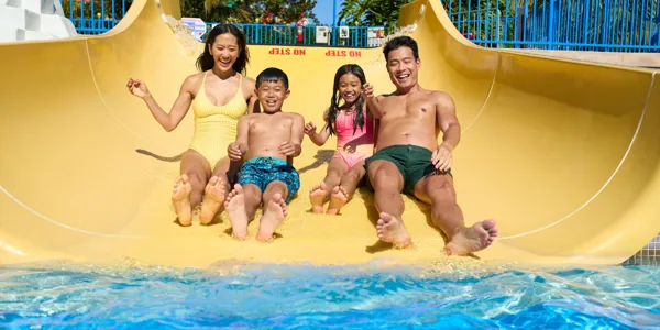 Family going down a slide at Legoland California Water Park