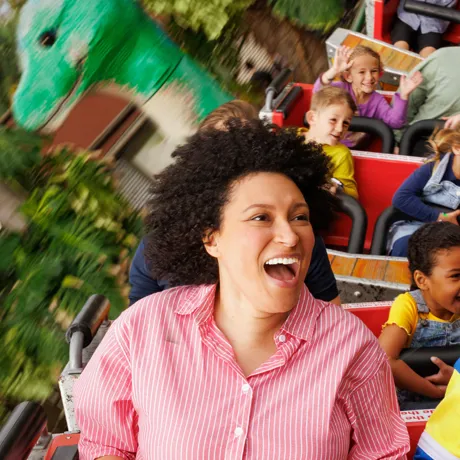 Parent and Kid riding Coastersaurus