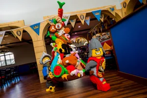 LEGO figured carry food out of Dragons Den Restaurant