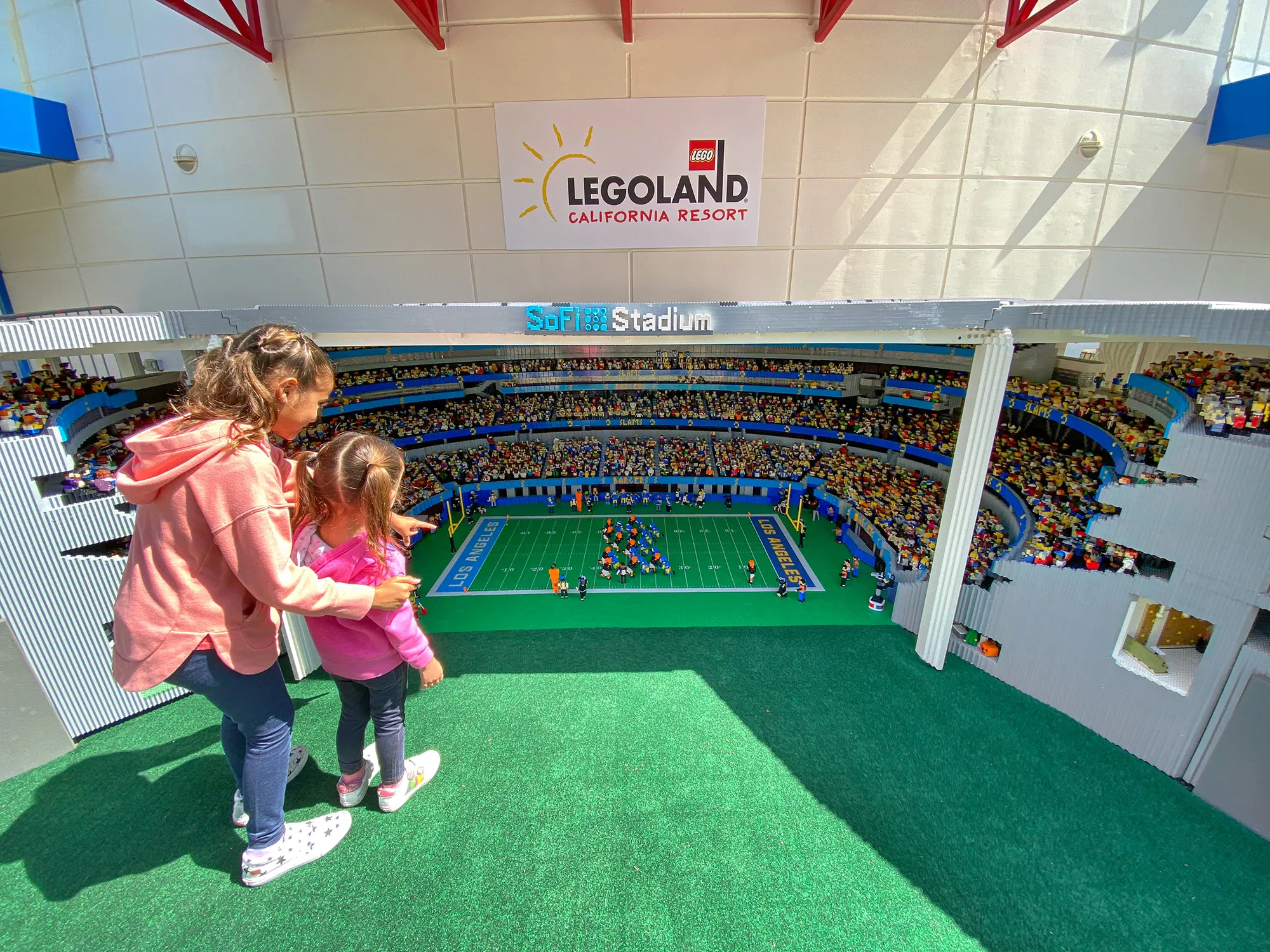 Girls looking at Sofi Stadium in MINILAND