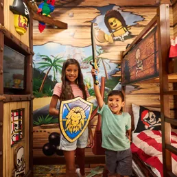 Kids Pose Heroically in a Pirate Room Kids Sleeping Area